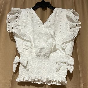 Girls top size small never used.